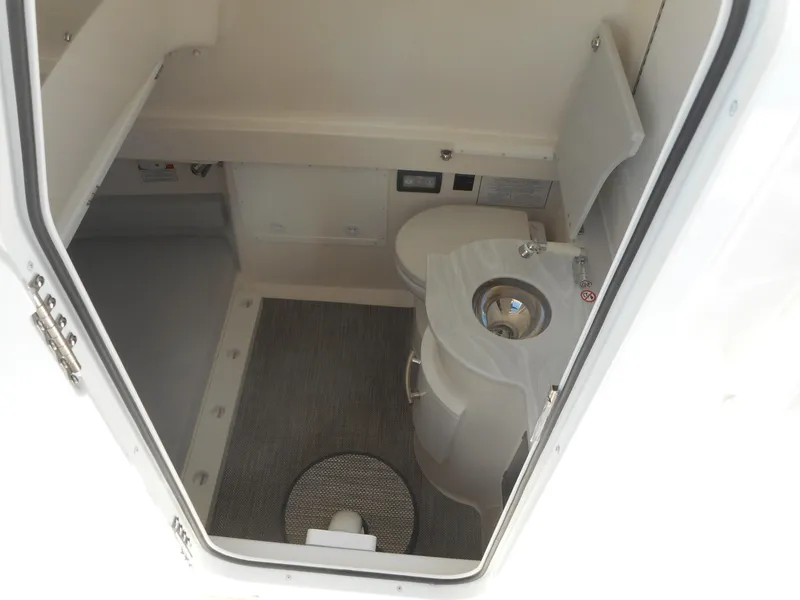 Slide: The Image of 2023 Regulator 34 boat interior bathroom with sink and toilet. - 19