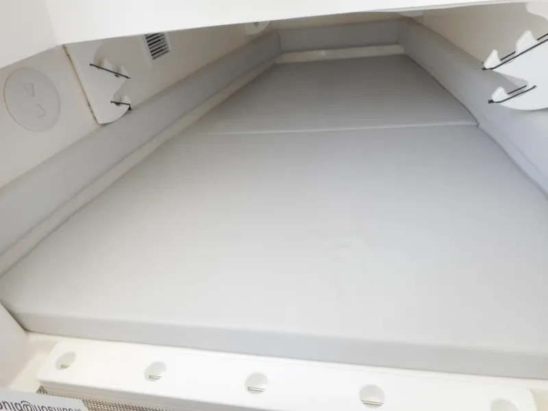 Slide: The Image of 2023 Regulator 34 boat cabin interior with cushioned sleeping area. - 20
