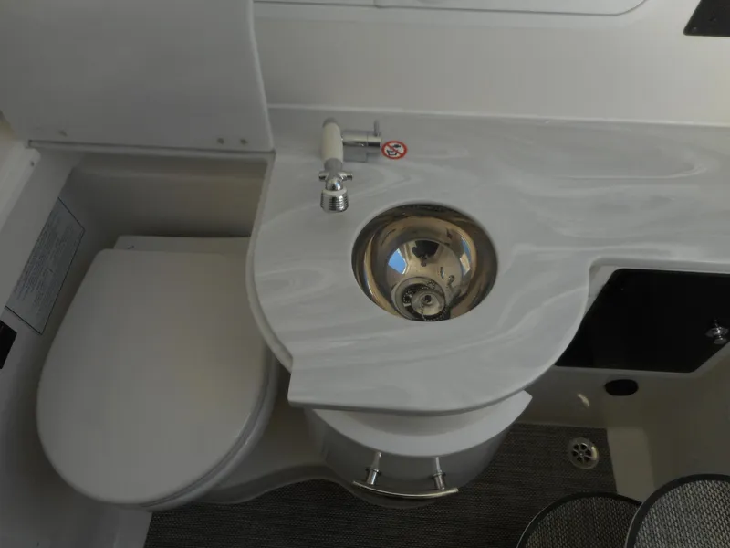 Slide: The Image of 2023 Regulator 34 boat bathroom with sink and toilet. - 21