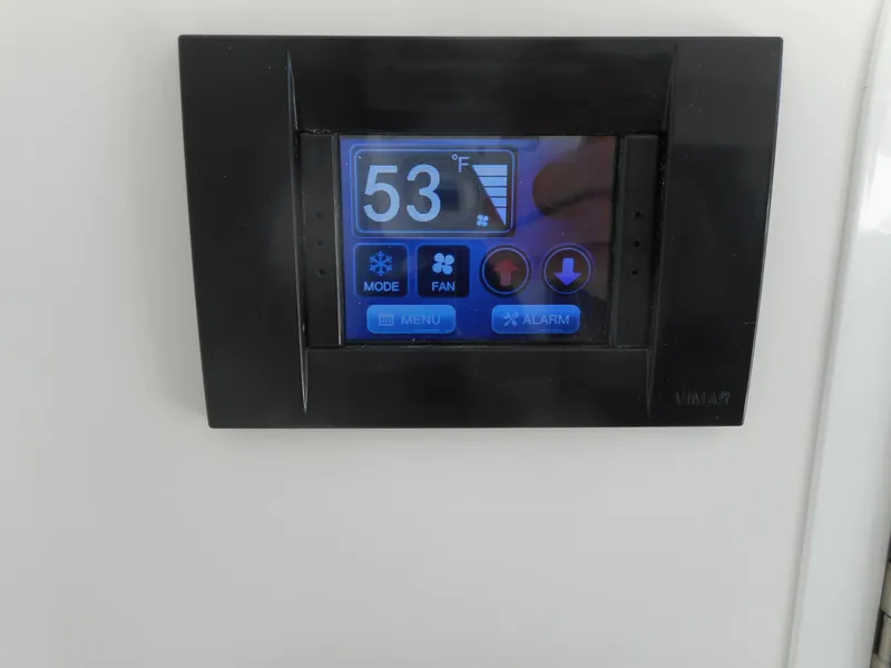 Slide: The Image of 2023 Regulator 34 digital thermostat displaying 53°F with control buttons. - 23