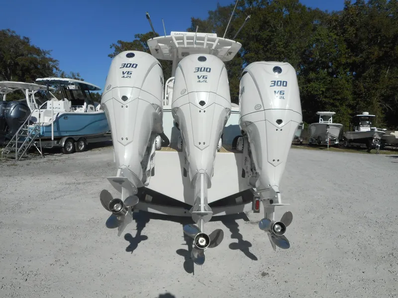 Slide: The Image of Triple 300 V6 outboard engines on a 2023 Regulator 34 boat. - 4