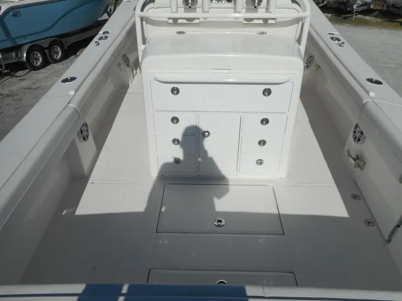 Slide: The Image of 2023 Regulator 34 boat interior with storage compartments and seating. - 5