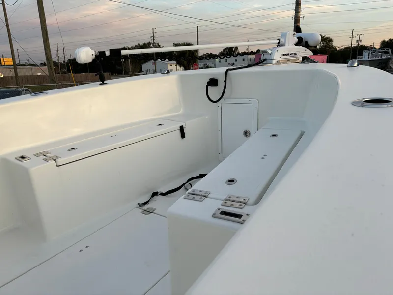 Slide: The Image of 2021 KenCraft 21 boat interior with storage compartments and clean white finish. - 12