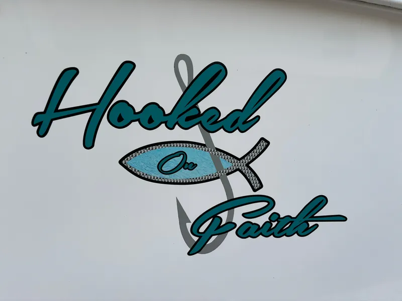 Slide: The Image of "Hooked on Faith" graphic on 2021 KenCraft 21 boat. - 19