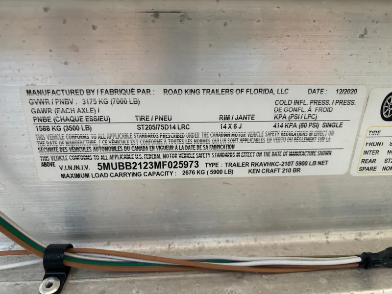Slide: The Image of Label on KenCraft 21 trailer, detailing specifications and manufacturing information, dated 12/2020. - 23