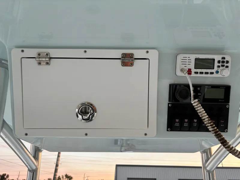 Slide: The Image of KenCraft 21 boat console with storage compartment and radio, 2021 model. - 25