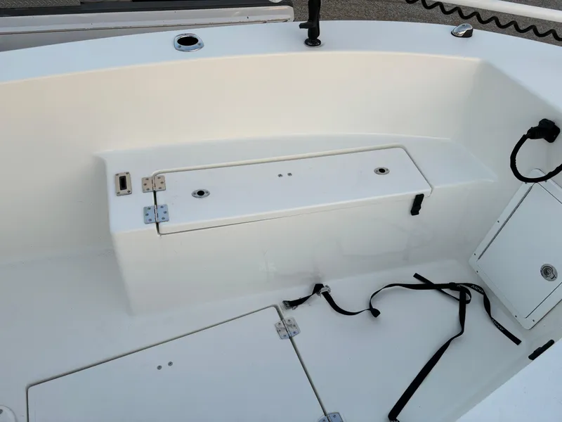 Slide: The Image of KenCraft 21 boat interior, 2021 model, featuring storage compartments and seating area. - 29