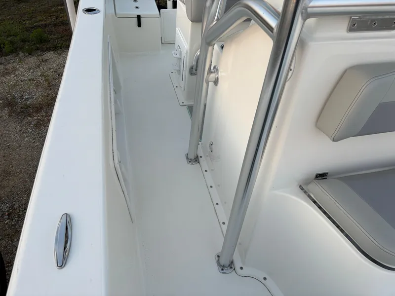 Slide: The Image of KenCraft 21 boat interior, 2021 model, featuring sleek white seating and stainless steel railings. - 32