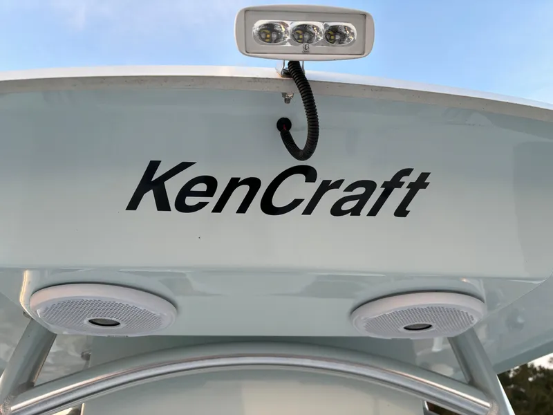 Slide: The Image of KenCraft 21 boat, 2021 model, featuring speakers and a mounted light. - 33