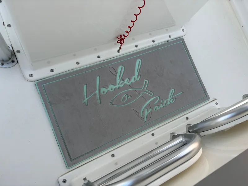 Slide: The Image of KenCraft 21 boat deck with "Hooked on Faith" mat, 2021 model. - 39
