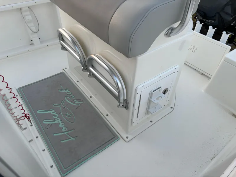 Slide: The Image of KenCraft 21 boat interior, 2021 model, featuring seating and a branded mat on the deck. - 40