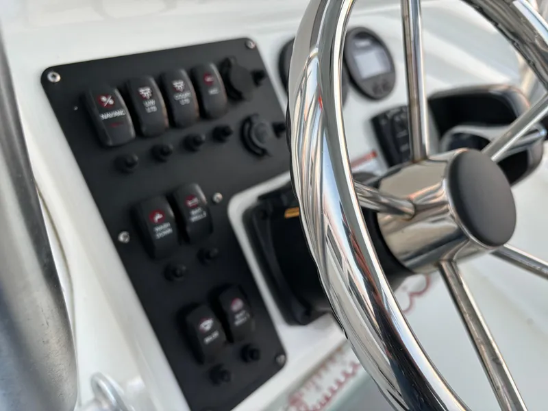 Slide: The Image of Steering wheel and control panel of 2021 KenCraft 21 boat. - 41