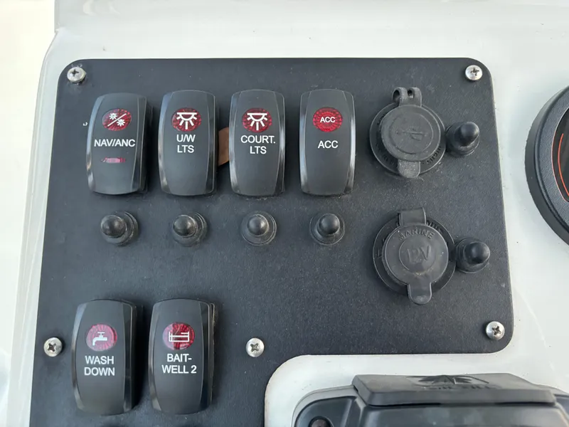 Slide: The Image of Control panel of a 2021 KenCraft 21 boat with labeled switches and outlets. - 43