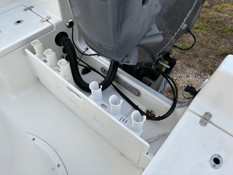Slide: The Image of KenCraft 21 boat engine area with rod holders, 2021 model. - 44