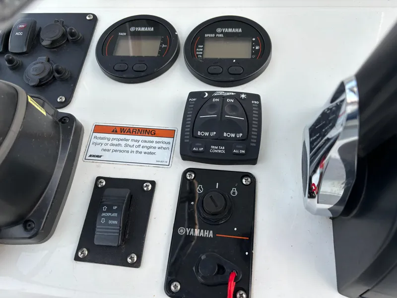 Slide: The Image of Control panel of a 2021 KenCraft 21 boat with Yamaha gauges and switches. - 46