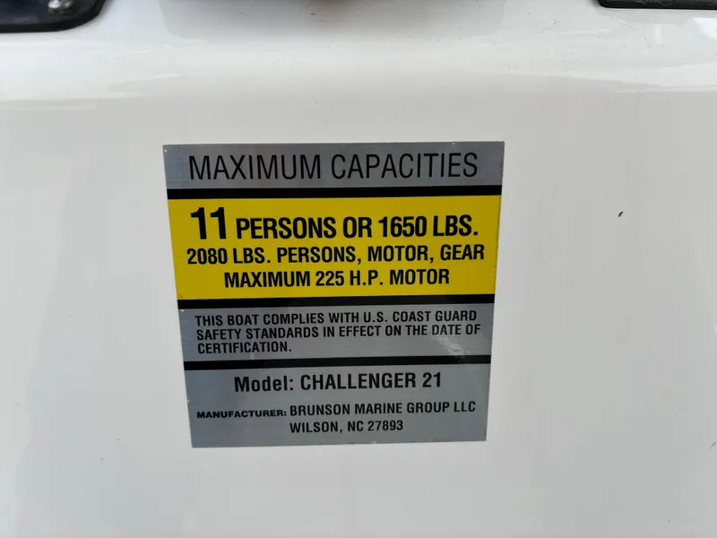 Slide: The Image of KenCraft 21 boat capacity label: 11 persons, 1650 lbs, 225 HP motor, Challenger 21 model. - 49