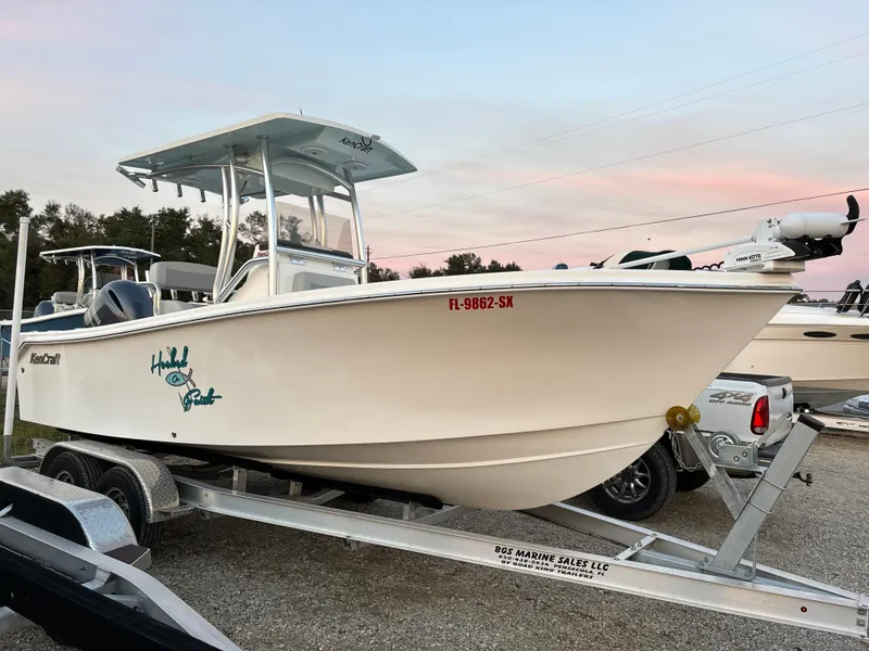 Slide: The Image of 2021 KenCraft 21 boat on trailer at sunset, side view. - 7
