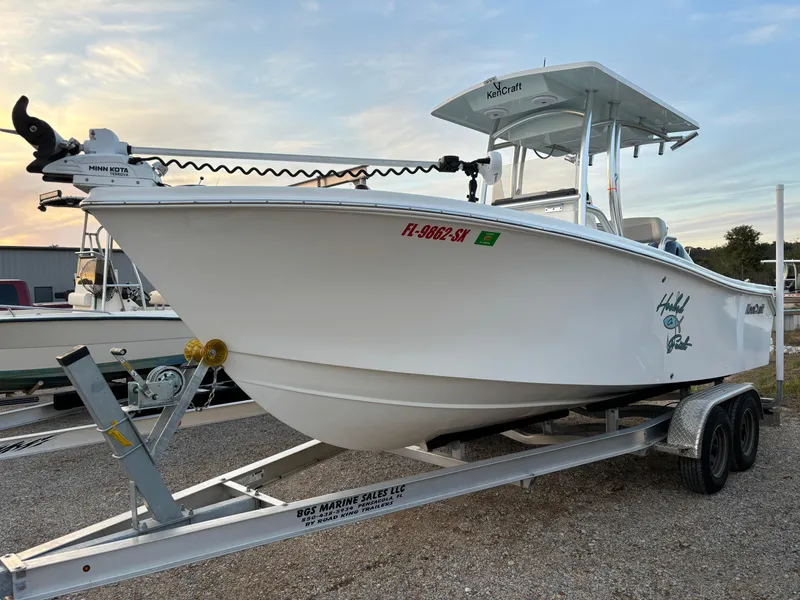 Slide: The Image of 2021 KenCraft 21 boat on trailer, white hull, parked outdoors. - 8