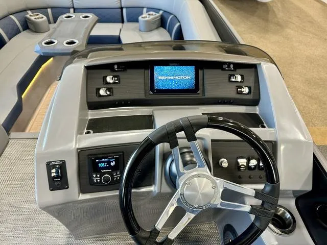 Slide: The Image of Dashboard of 2024 Bennington 25 LTSB boat with Simrad display and controls. - 14