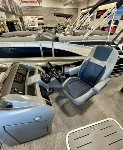 Slide: The Image of 2024 Bennington 25 LTSB boat interior with modern seating and ambient lighting. - 17