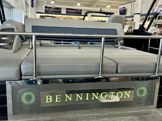 Slide: The Image of 2024 Bennington 25 LTSB boat interior with modern seating and control panel. - 23