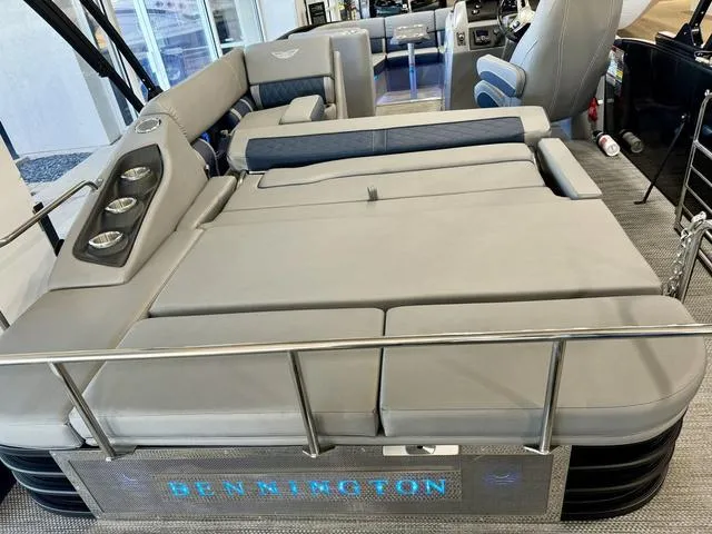 Slide: The Image of 2024 Bennington 25 LTSB pontoon boat interior with modern seating and ambient lighting. - 24