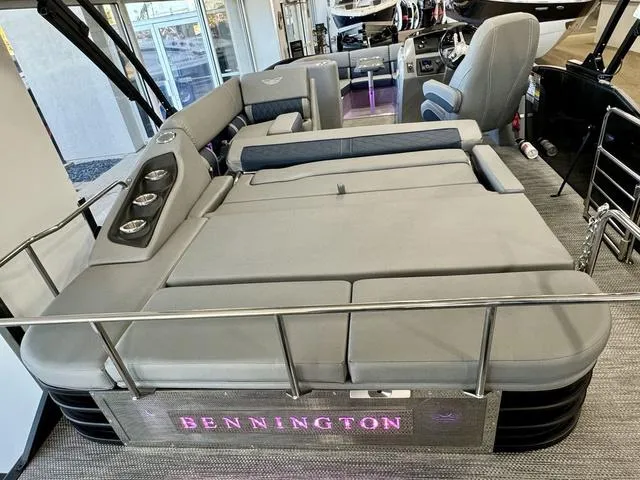 Slide: The Image of 2024 Bennington 25 LTSB boat interior with modern seating and ambient lighting. - 25