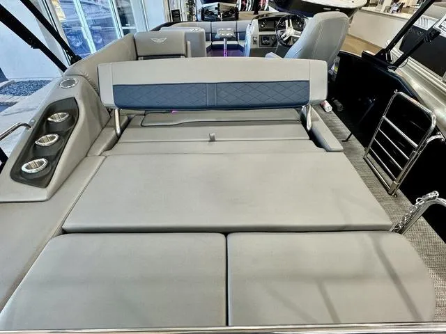 Slide: The Image of 2024 Bennington 25 LTSB pontoon boat with comfortable seating and sleek design. - 26