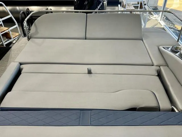 Slide: The Image of 2024 Bennington 25 LTSB boat interior with spacious seating and cup holders. - 27