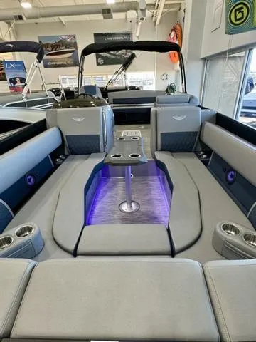 Slide: The Image of 2024 Bennington 25 LTSB boat interior with luxurious seating and cup holders. - 28