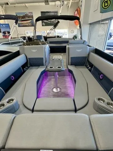 Slide: The Image of 2024 Bennington 25 LTSB pontoon boat with luxurious seating and modern design. - 29