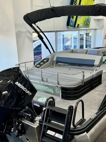 Slide: The Image of 2024 Bennington 25 LTSB boat interior with plush seating and cup holders. - 31