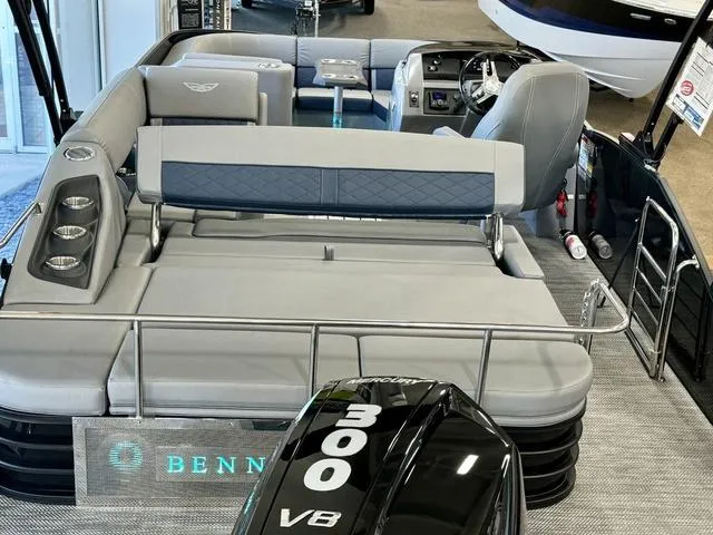 Slide: The Image of 2024 Bennington 25 LTSB boat interior with plush seating and illuminated branding. - 32
