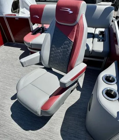 Slide: The Image of 2024 Bennington 20 SSB boat interior with red and gray seating. - 10