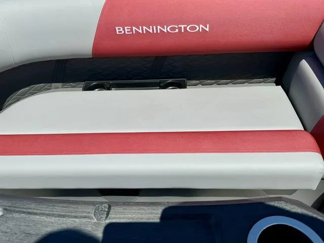 Slide: The Image of 2024 Bennington 20 SSB boat seat with red and white upholstery. - 11