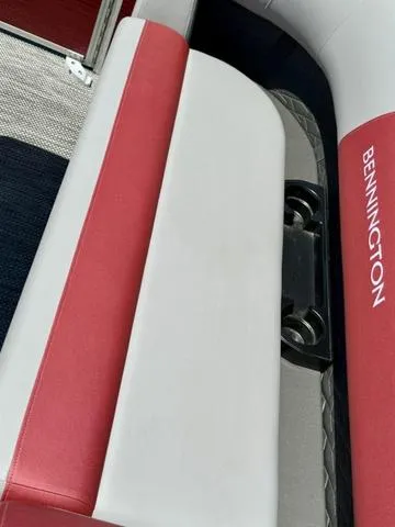 Slide: The Image of 2024 Bennington 20 SSB boat interior with red and white seating. - 13