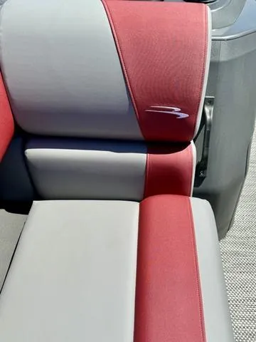 Slide: The Image of 2024 Bennington 20 SSB boat seat with red and gray upholstery. - 18