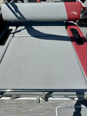 Slide: The Image of 2024 Bennington 20 SSB boat with gray and red seating. - 20