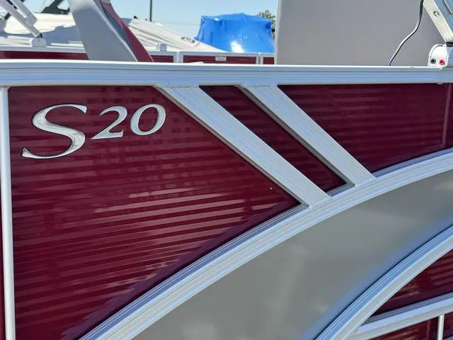 Slide: The Image of 2024 Bennington 20 SSB pontoon boat, maroon and silver exterior detailing. - 22