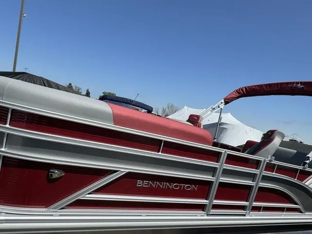 Slide: The Image of 2024 Bennington 20 SSB pontoon boat with red and silver detailing. - 4