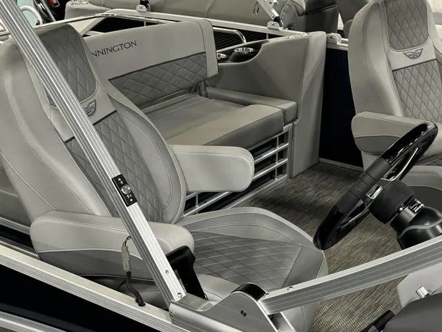 Slide: The Image of 2024 Bennington 23 LSB boat interior with luxurious gray seating and modern design. - 14