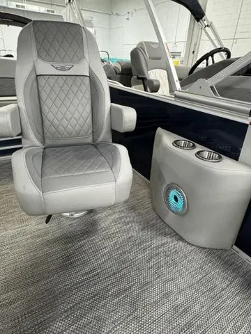 Slide: The Image of 2024 Bennington 23 LSB boat interior with luxury seating and cup holders. - 25