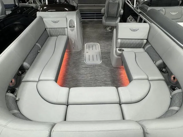 Slide: The Image of 2024 Bennington 23 LSB boat interior with luxurious seating and ambient lighting. - 28