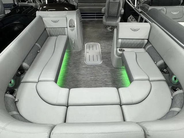 Slide: The Image of 2024 Bennington 23 LSB boat interior with luxurious seating and ambient lighting. - 29