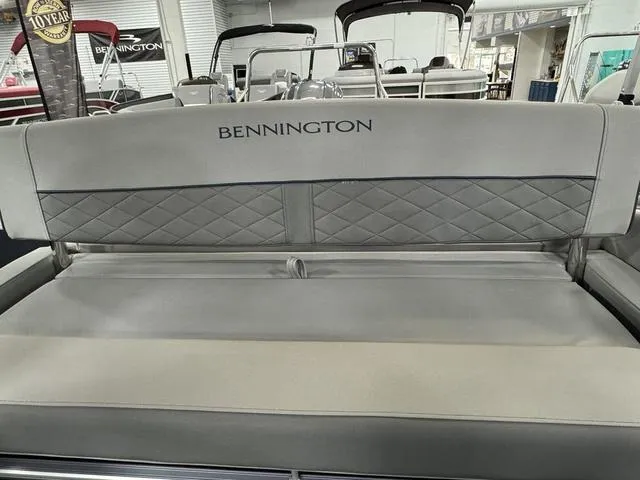 Slide: The Image of 2024 Bennington 23 LSB boat interior with gray quilted seating in showroom. - 31
