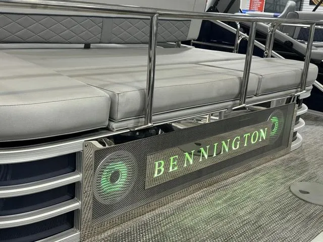 Slide: The Image of 2024 Bennington 23 LSB boat with cushioned seating and illuminated logo. - 36