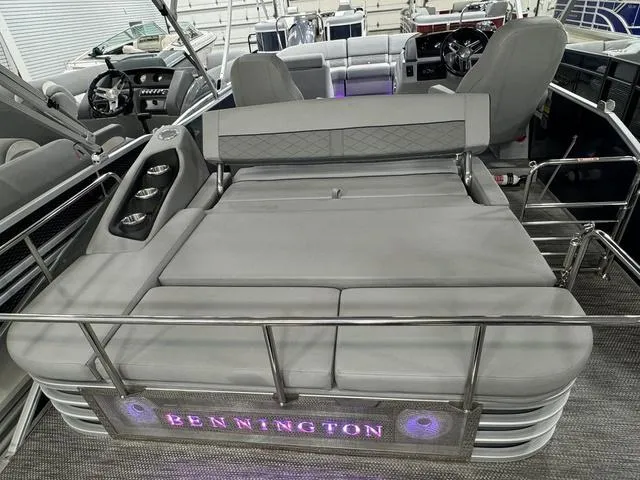 Slide: The Image of 2024 Bennington 23 LSB pontoon boat with luxurious seating and illuminated branding. - 40