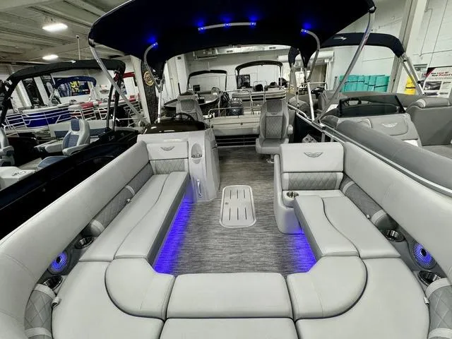Slide: The Image of 2024 Bennington 23 LSB pontoon boat with luxurious seating and ambient blue lighting. - 43