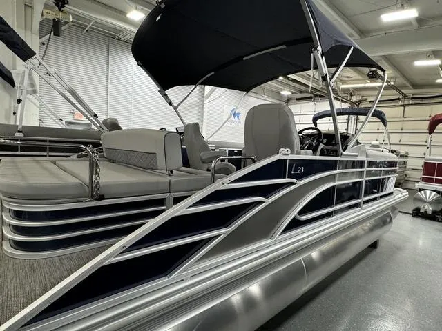 Slide: The Image of 2024 Bennington 23 LSB pontoon boat interior with gray seating and carpet. - 7