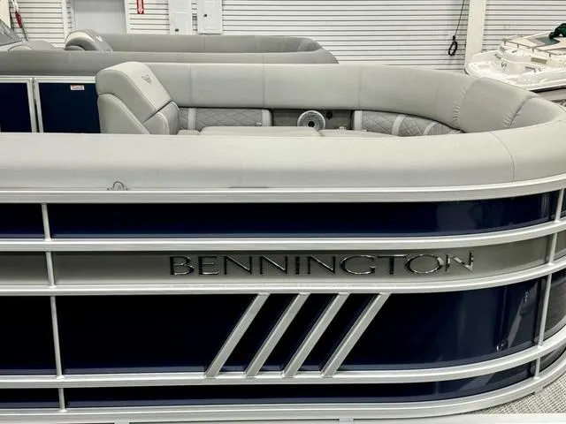 Slide: The Image of 2024 Bennington 23 LSB boat interior with cushioned seating and cup holders. - 8